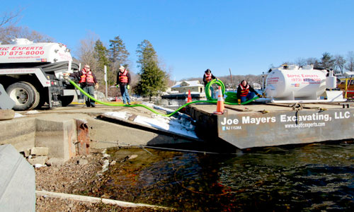 Barge pumping from dock